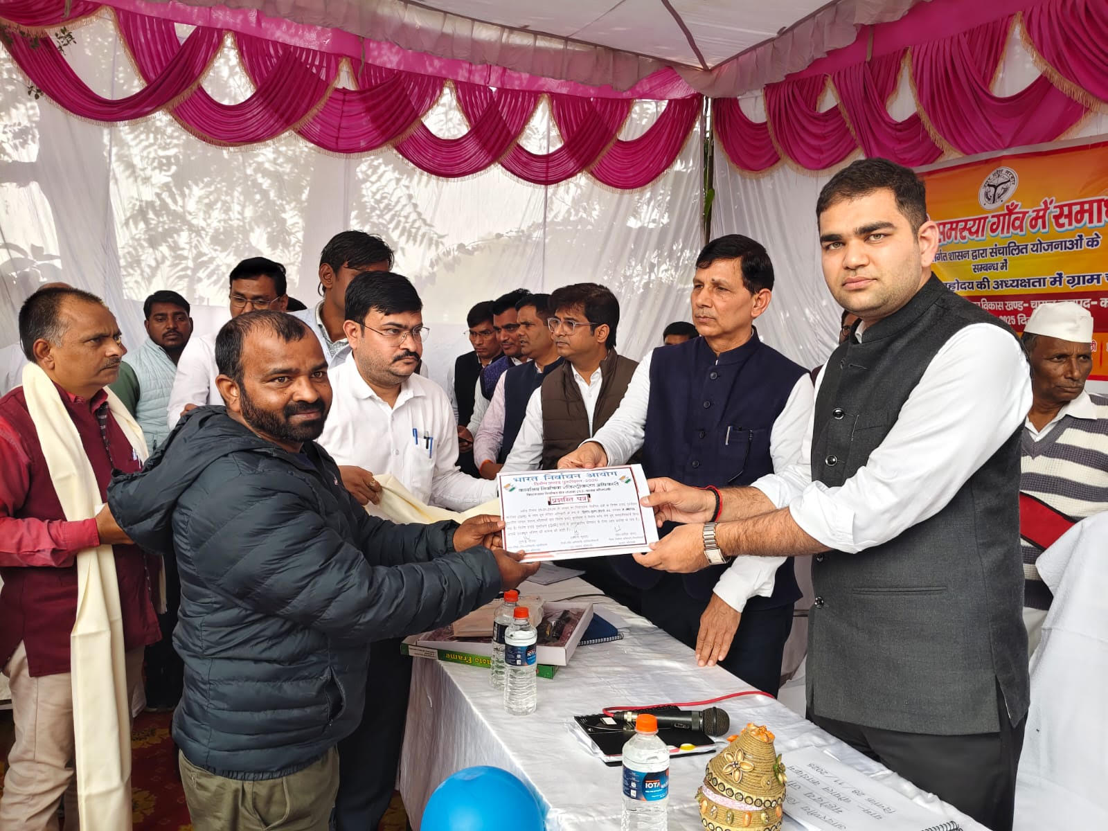 District Election Officer honored two booth level officers for their excellent work.