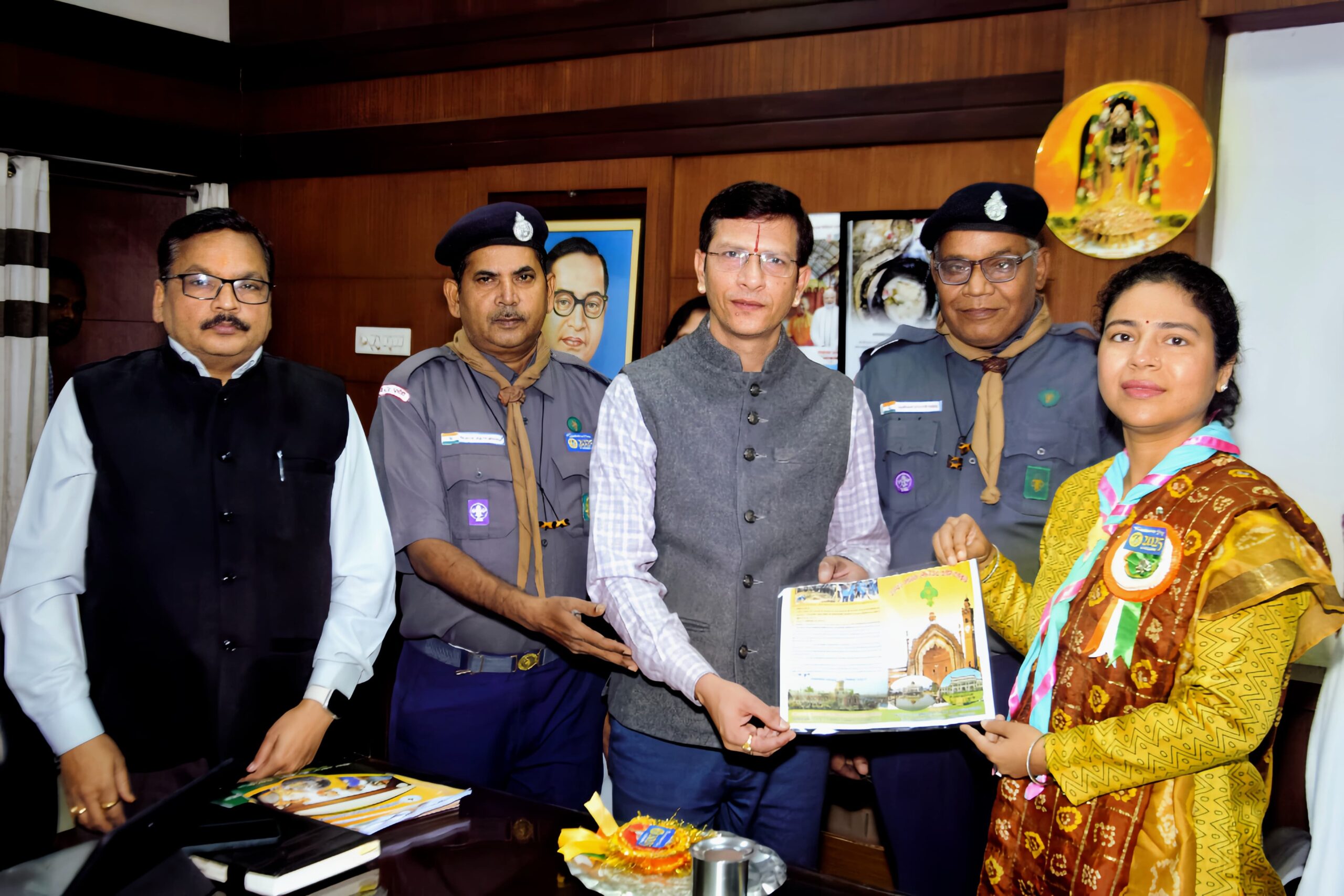 Scout Guide officials met the DM, presented him with scarf and badge and wished him on the foundation day.